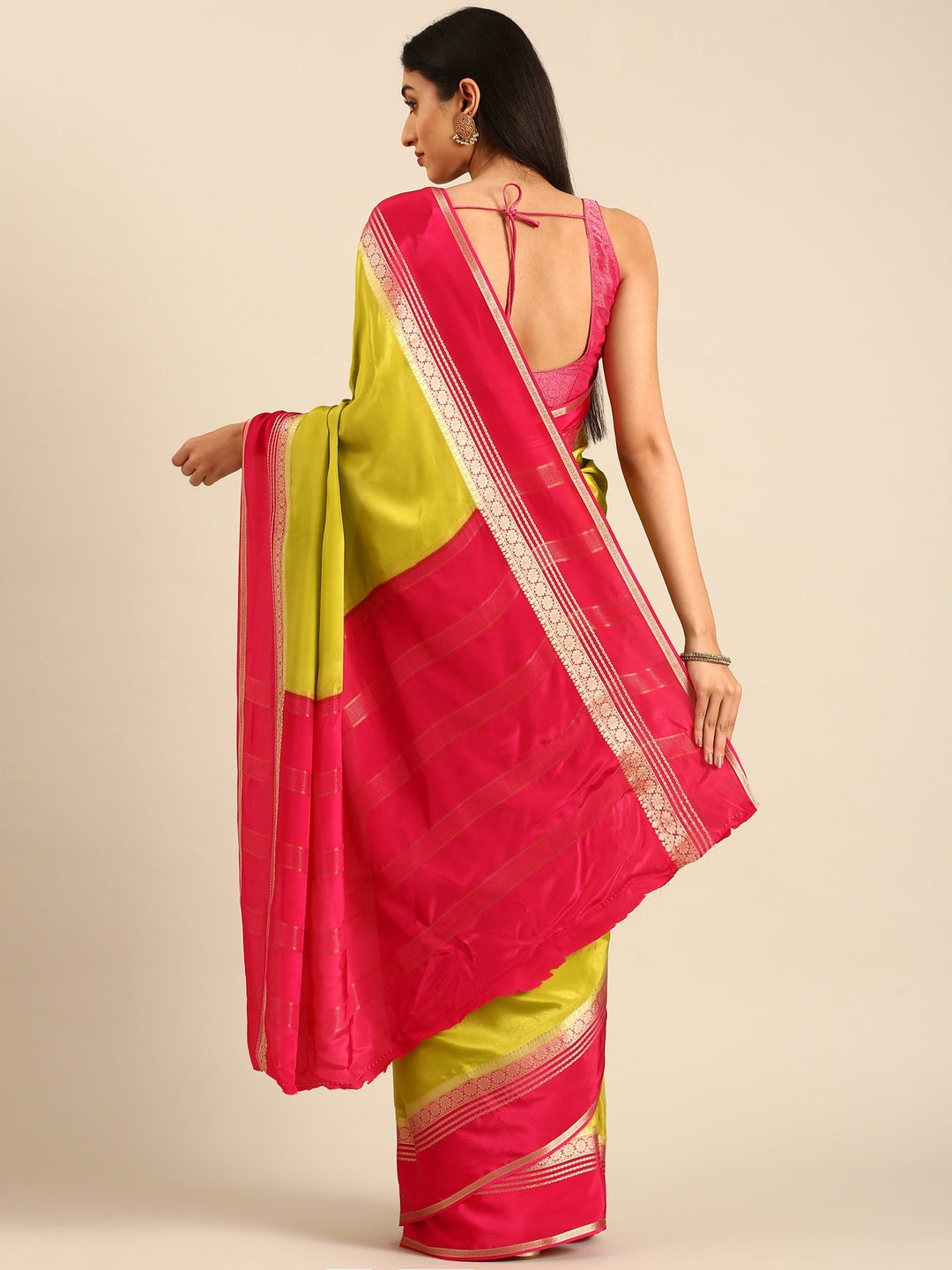 Neerus Green silk woven saree with contrast border and pallu - back view