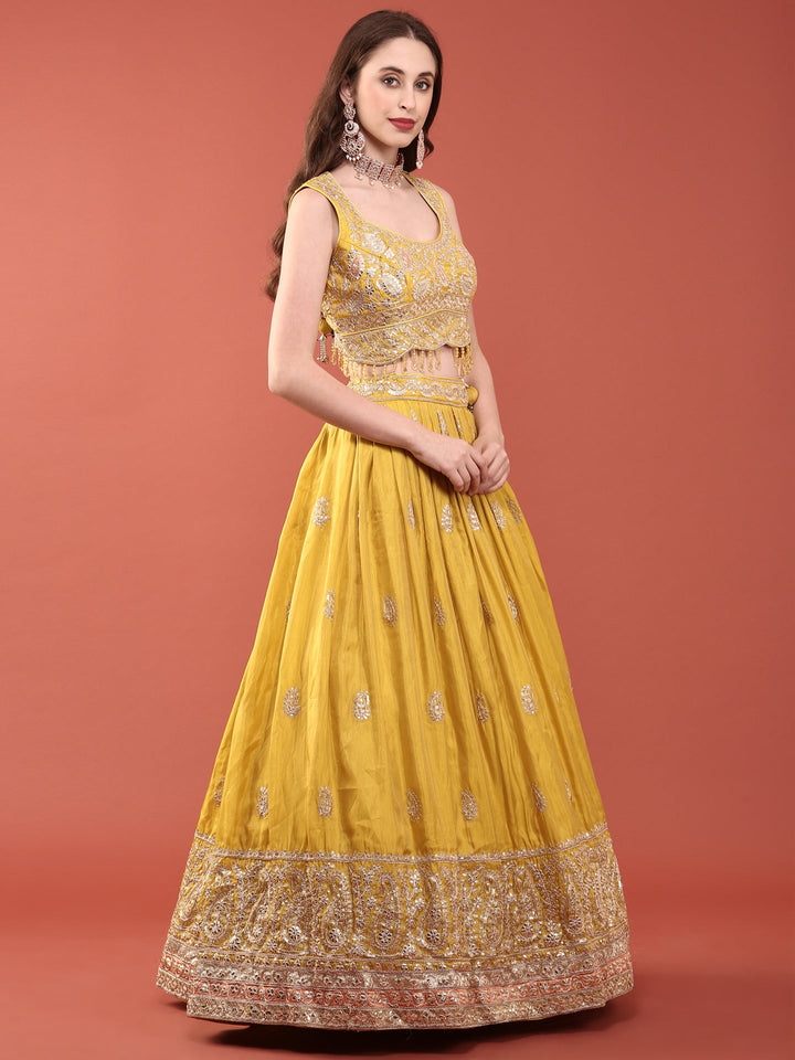 Neerus Yellow silk embroidered lehenga set - side view