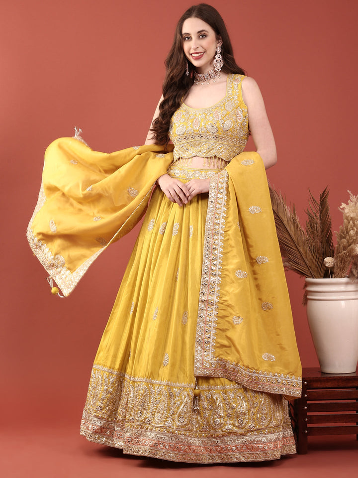 Neerus Yellow silk embroidered lehenga set - front view