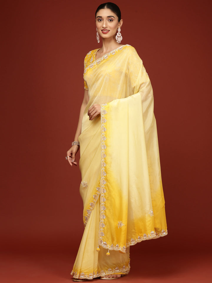 Neerus Yellow silk embellished saree with stone work - back view