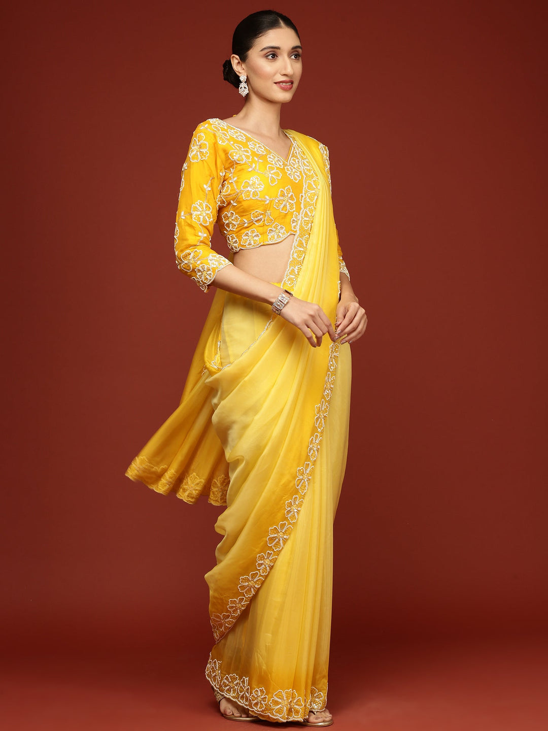 Neerus Yellow silk embellished saree with stone work - back view