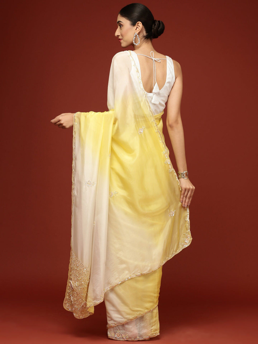 Neerus Yellow crepe embellished saree - side view