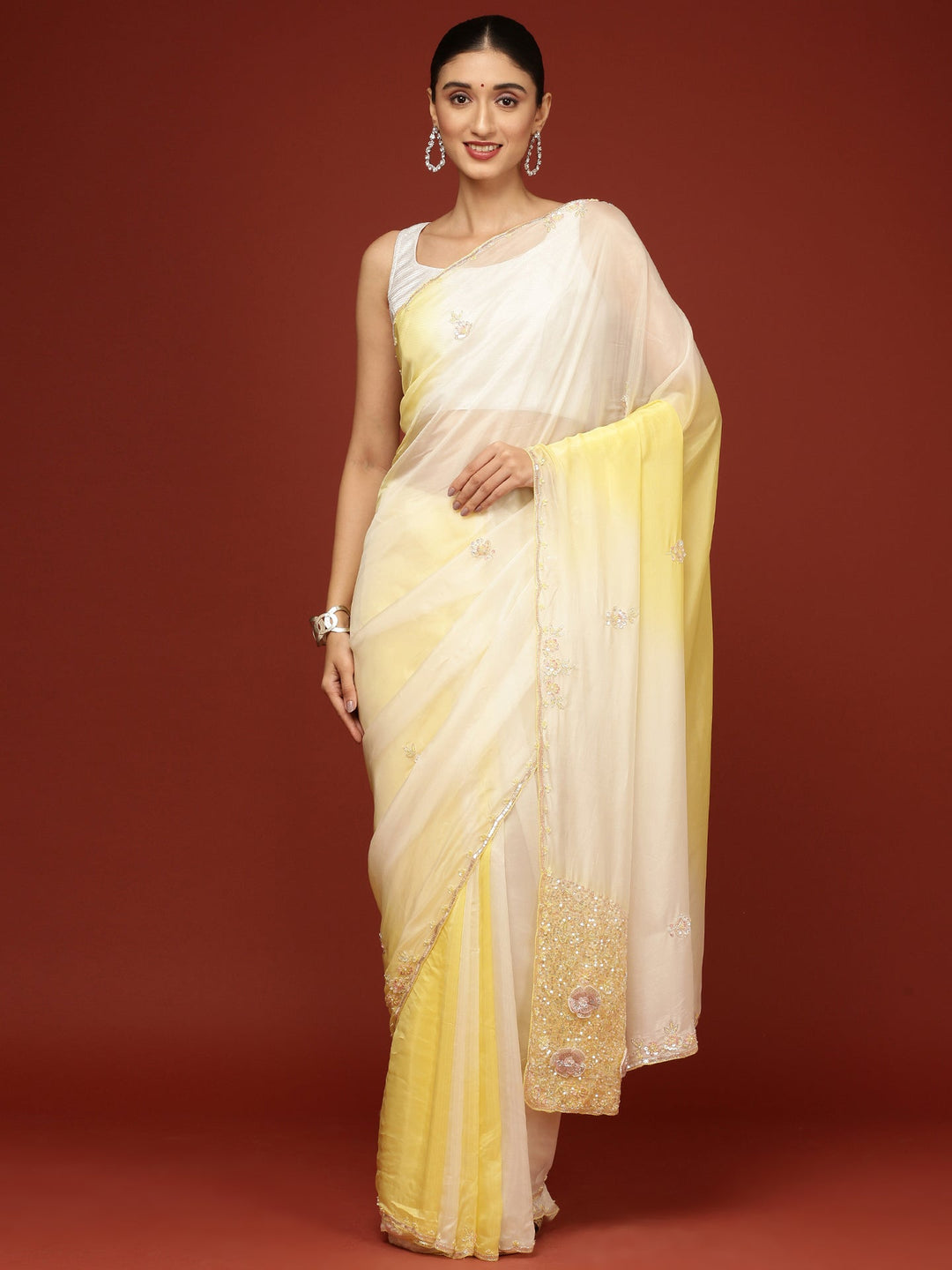 Neerus Yellow crepe embellished saree - front view