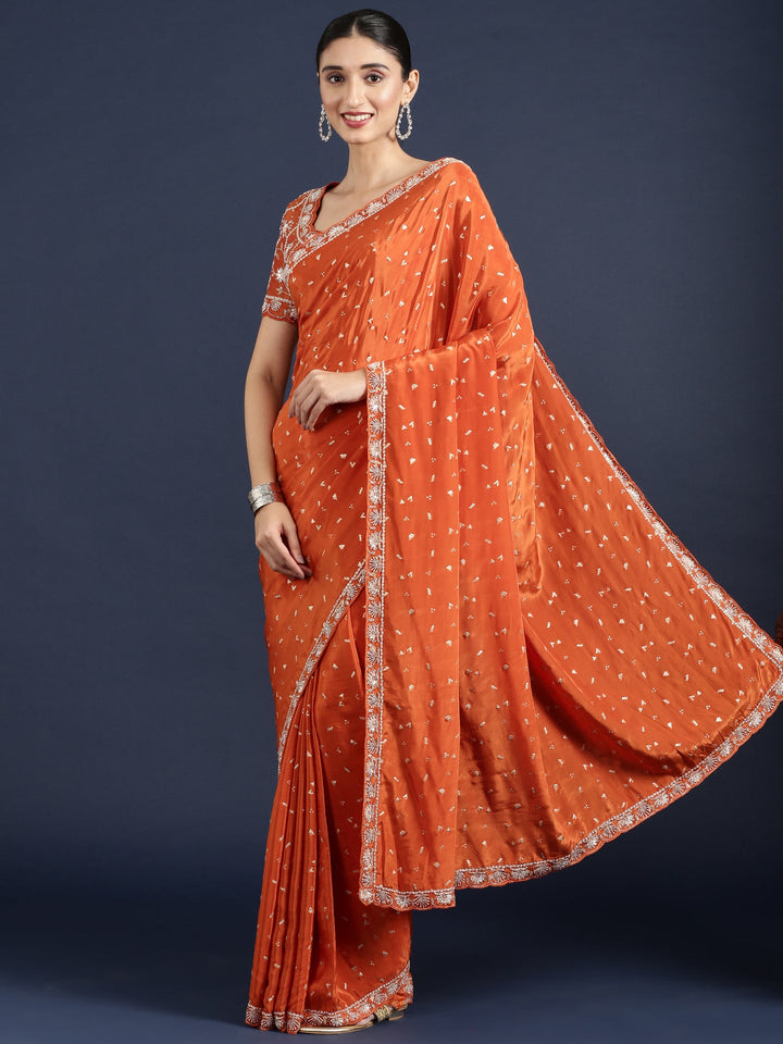 Neerus Orange crepe embellished saree with readymade blouse - front view