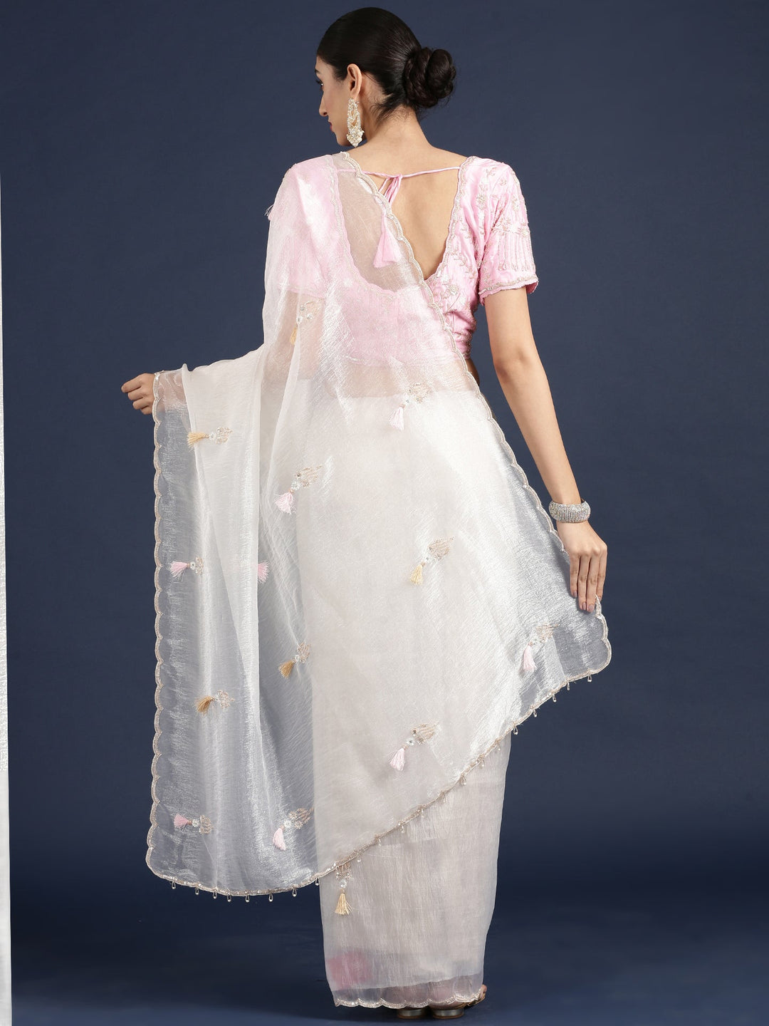 Neerus White crepe embroidered saree with blouse - side view