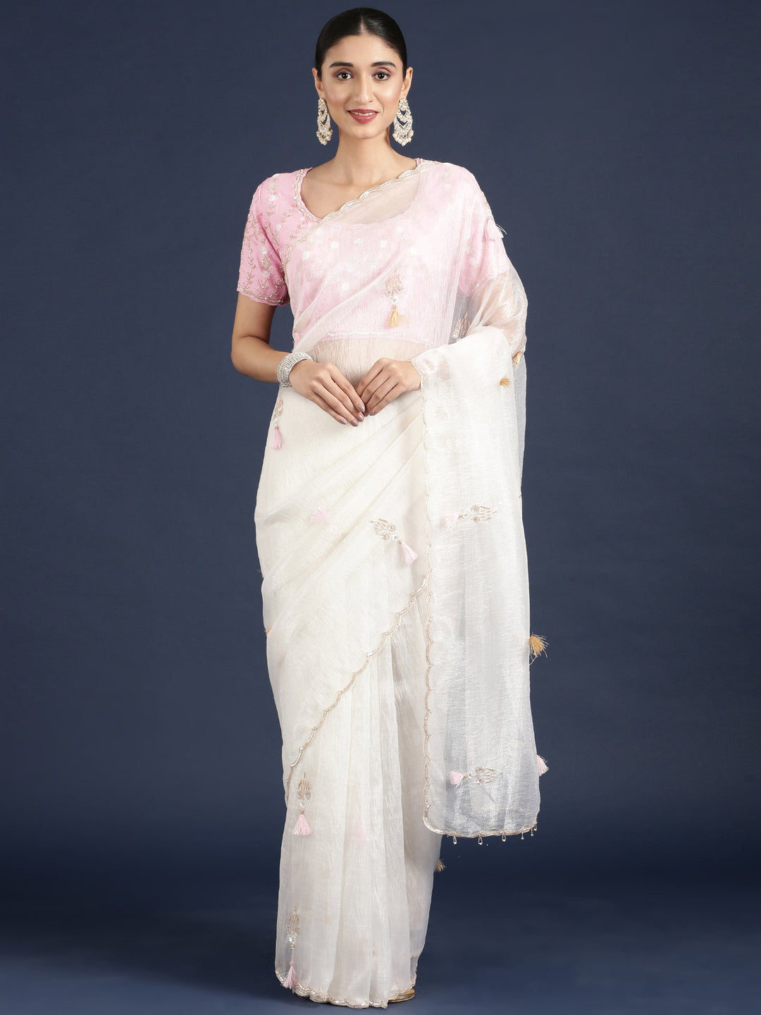 Neerus White crepe embroidered saree with blouse - front view