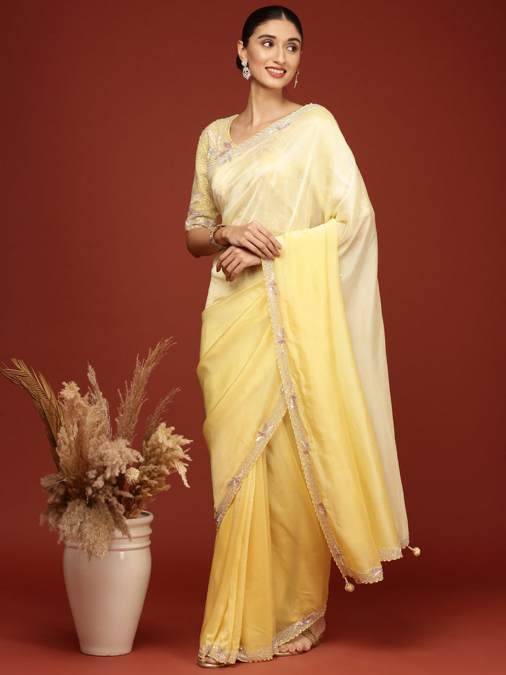 Neerus Yellow crepe embellished saree with readymade blouse - back view