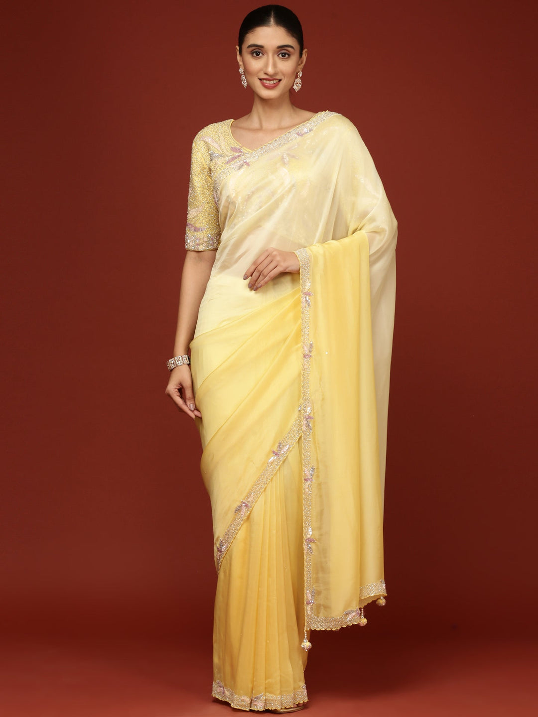 Neerus Yellow crepe embellished saree with readymade blouse - front view