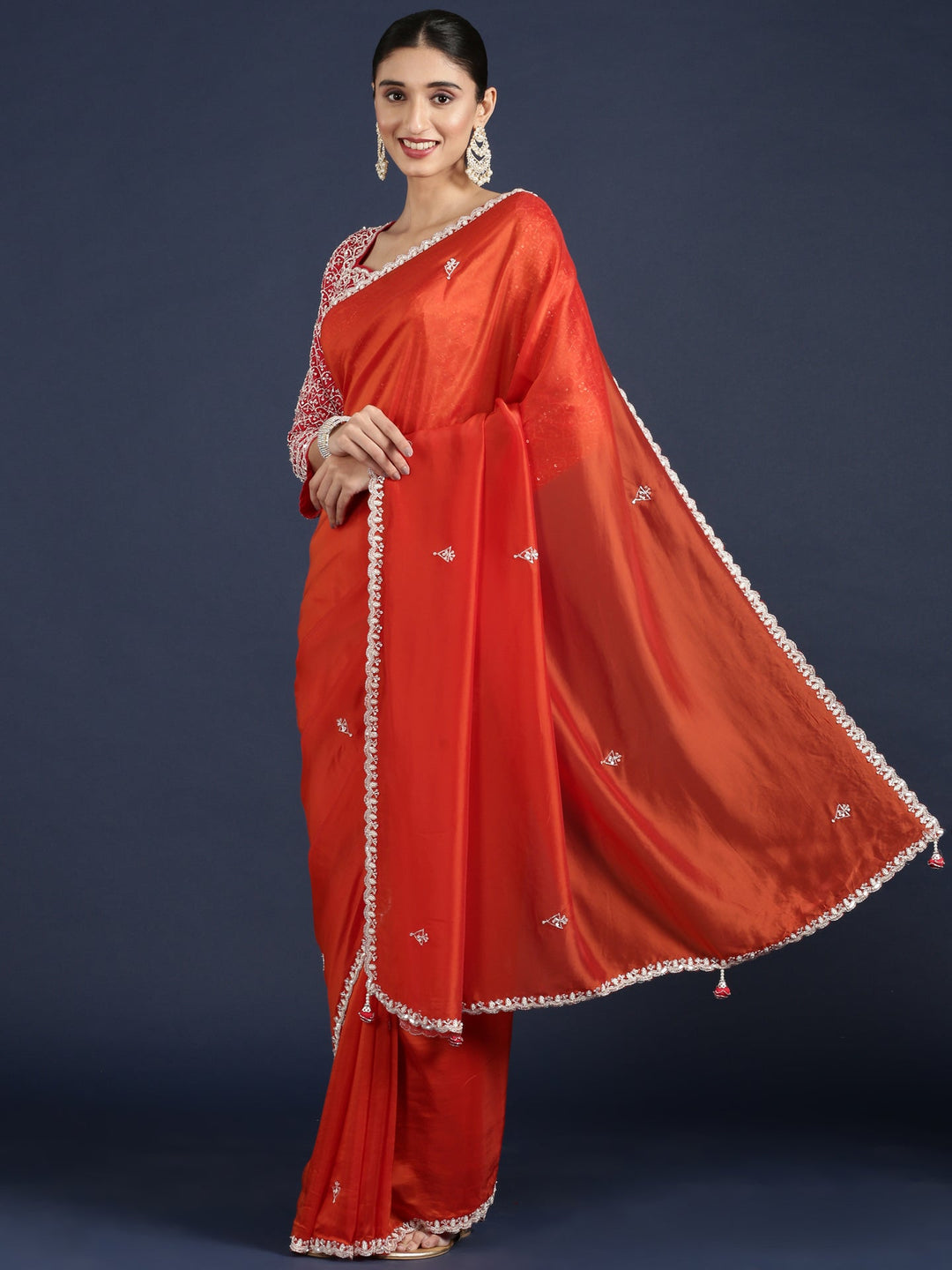 Neerus Orange crepe embellished saree with readymade blouse - front view