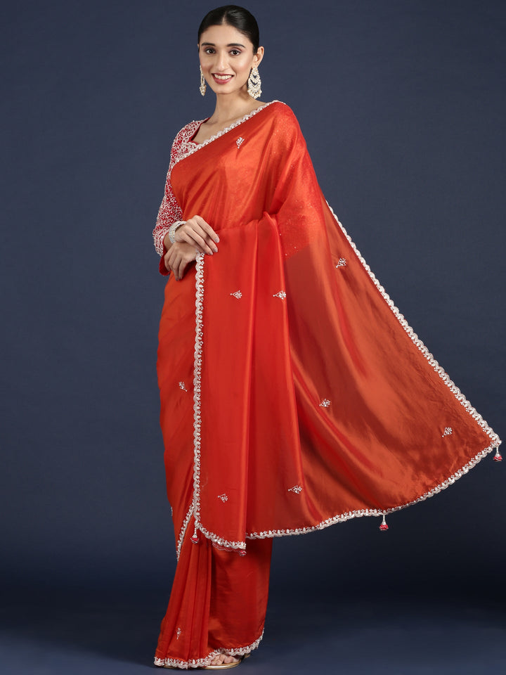 Neerus Orange crepe embellished saree with readymade blouse - front view