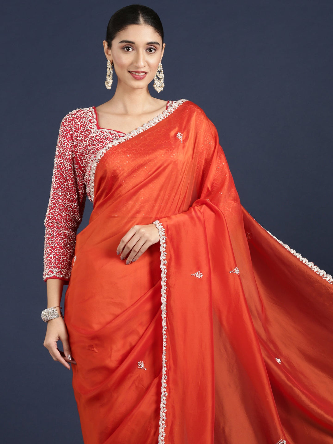 Neerus Orange crepe embellished saree with readymade blouse - back view