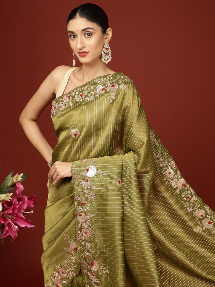 Neerus Green tissue hand embroidered saree - back view
