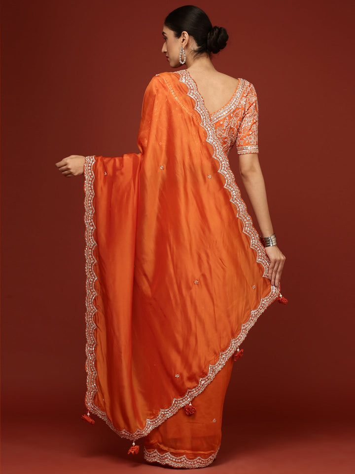 Neerus Orange crepe embellished saree with readymade blouse - side view