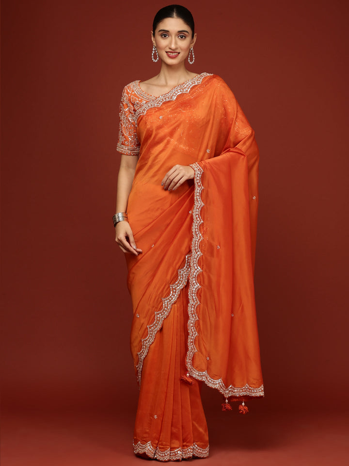 Neerus Orange crepe embellished saree with readymade blouse - front view