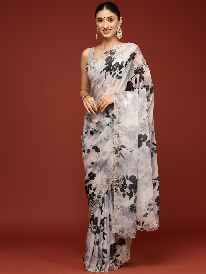 Neerus Black crepe woven saree with white contrast - front view