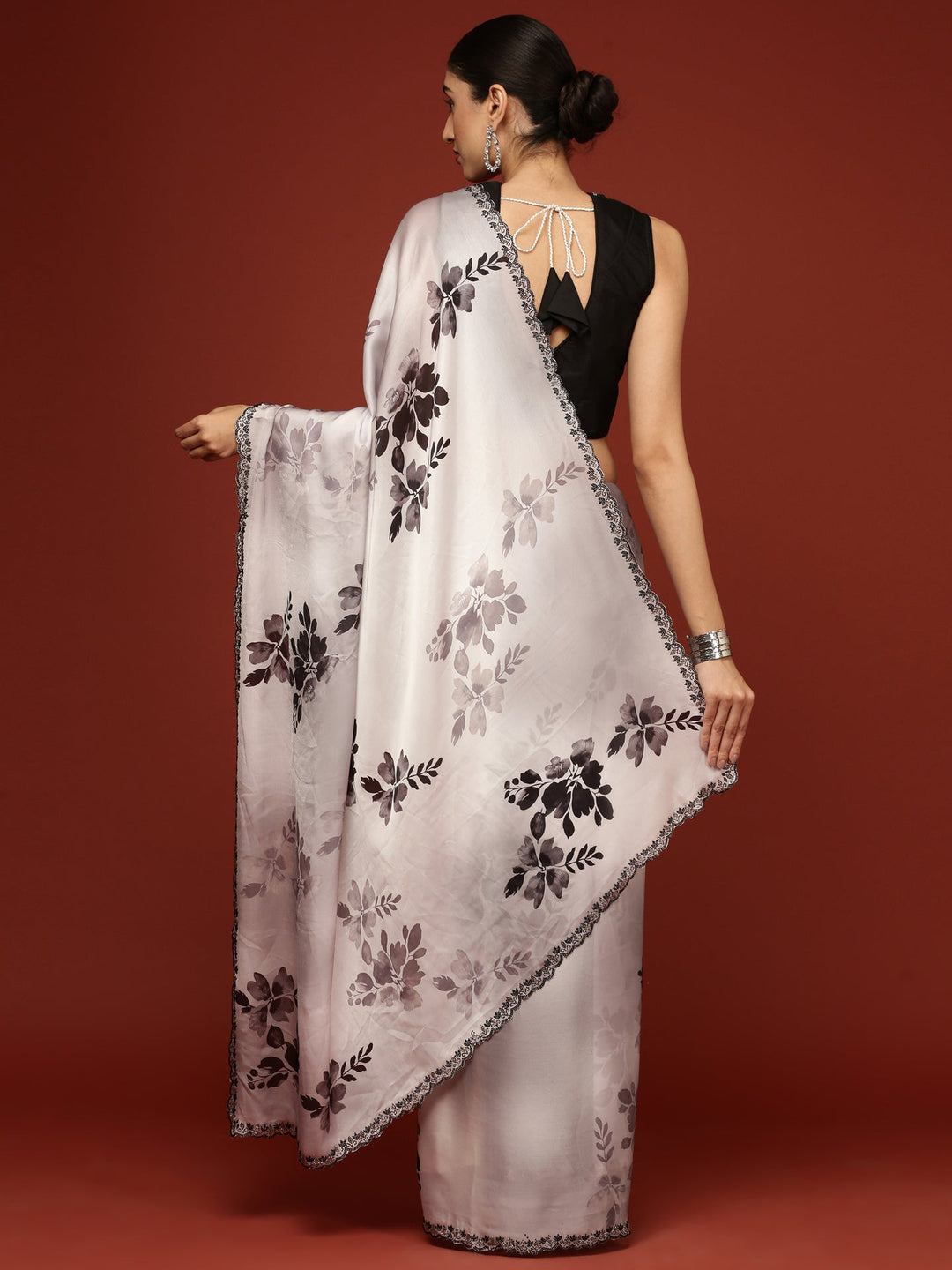 Neerus Black crepe woven saree with blouse - back view