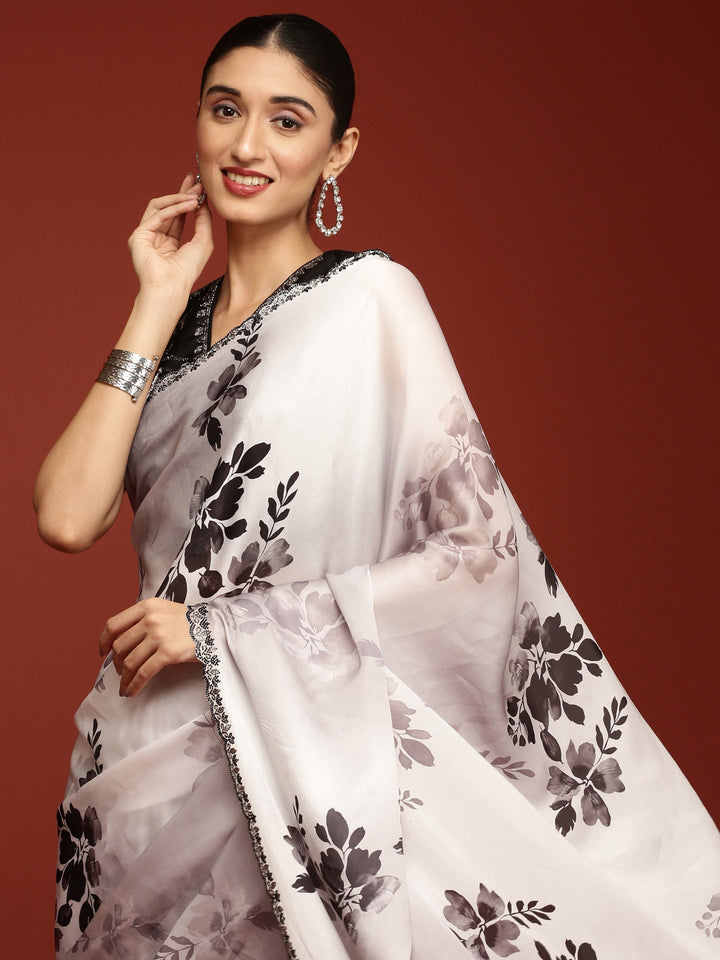 Neerus Black crepe woven saree with blouse - side view