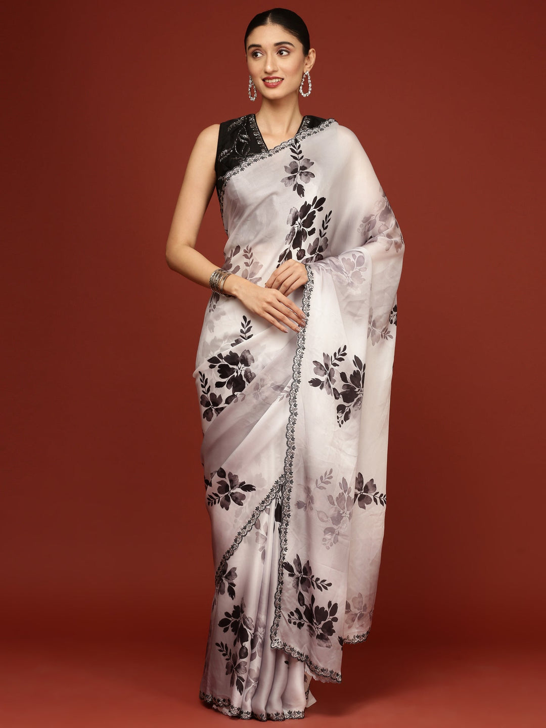 Neerus Black crepe woven saree with blouse - front view