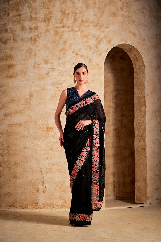 Neerus Black georgette solid saree - front view