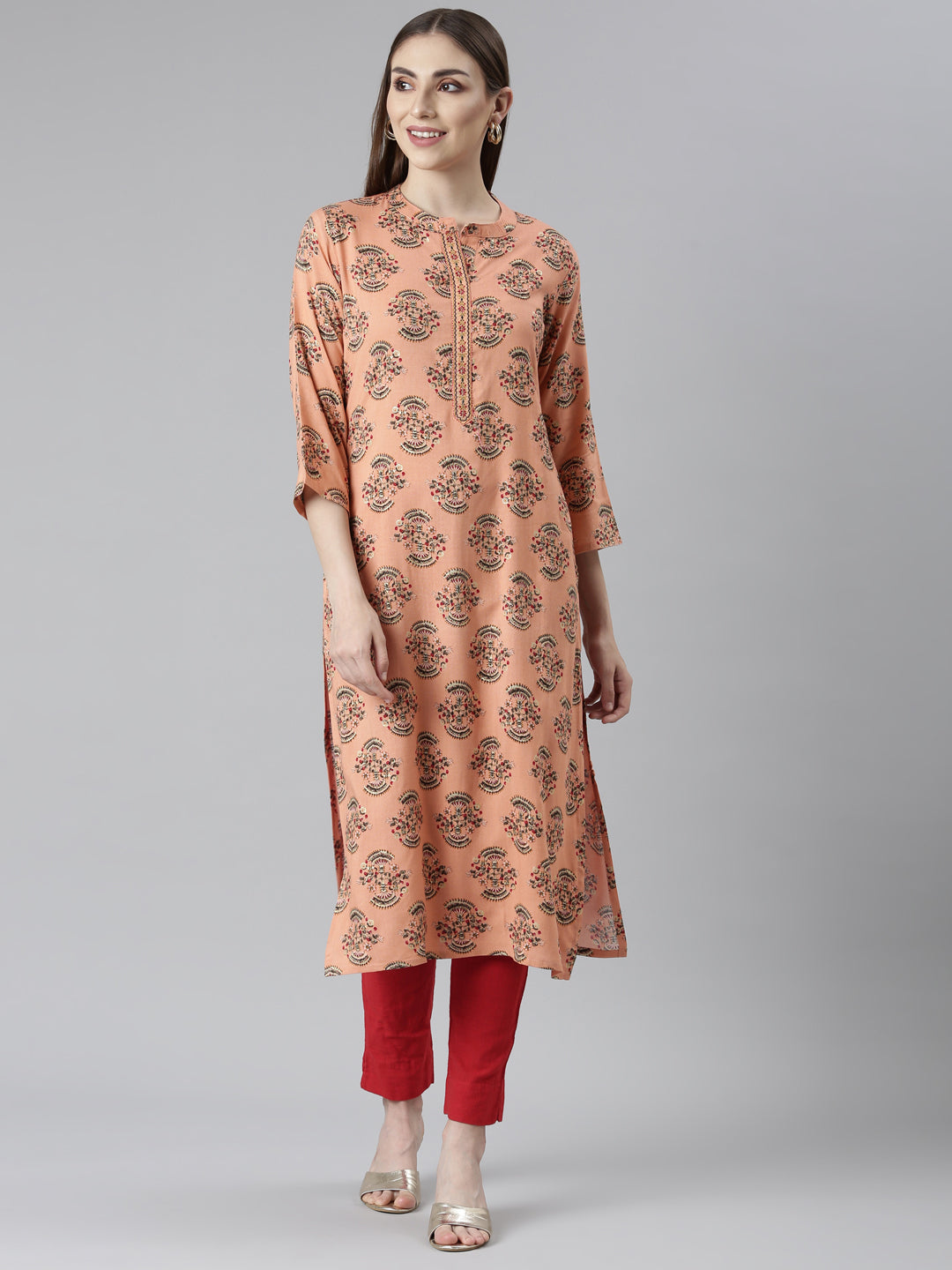 Neerus Orange rayon printed floral straight kurti - front view