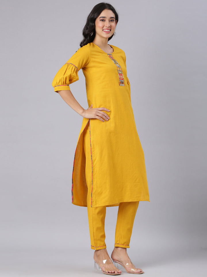 Neerus Mustard Solid Straight Kurta And Trousers