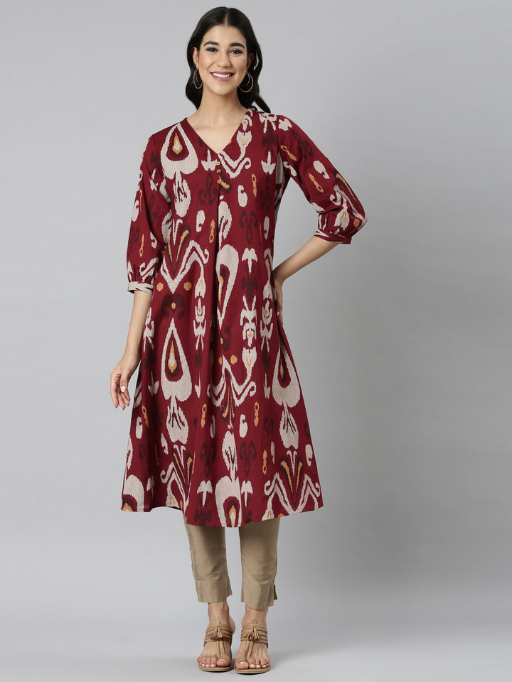 Neerus Maroon printed quirky straight kurti - front view