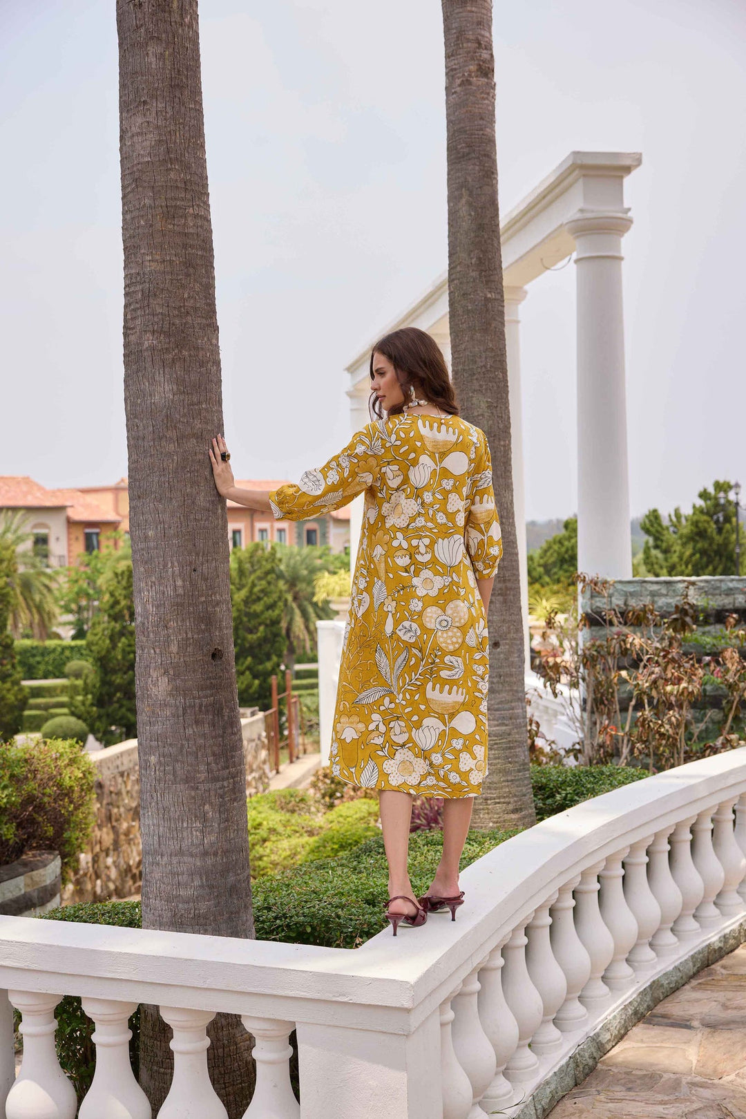 Neerus Yellow linen printed A-line kurti - back view
