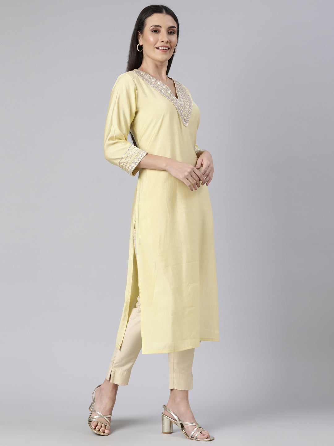 Neerus Yellow solid straight kurti - back view