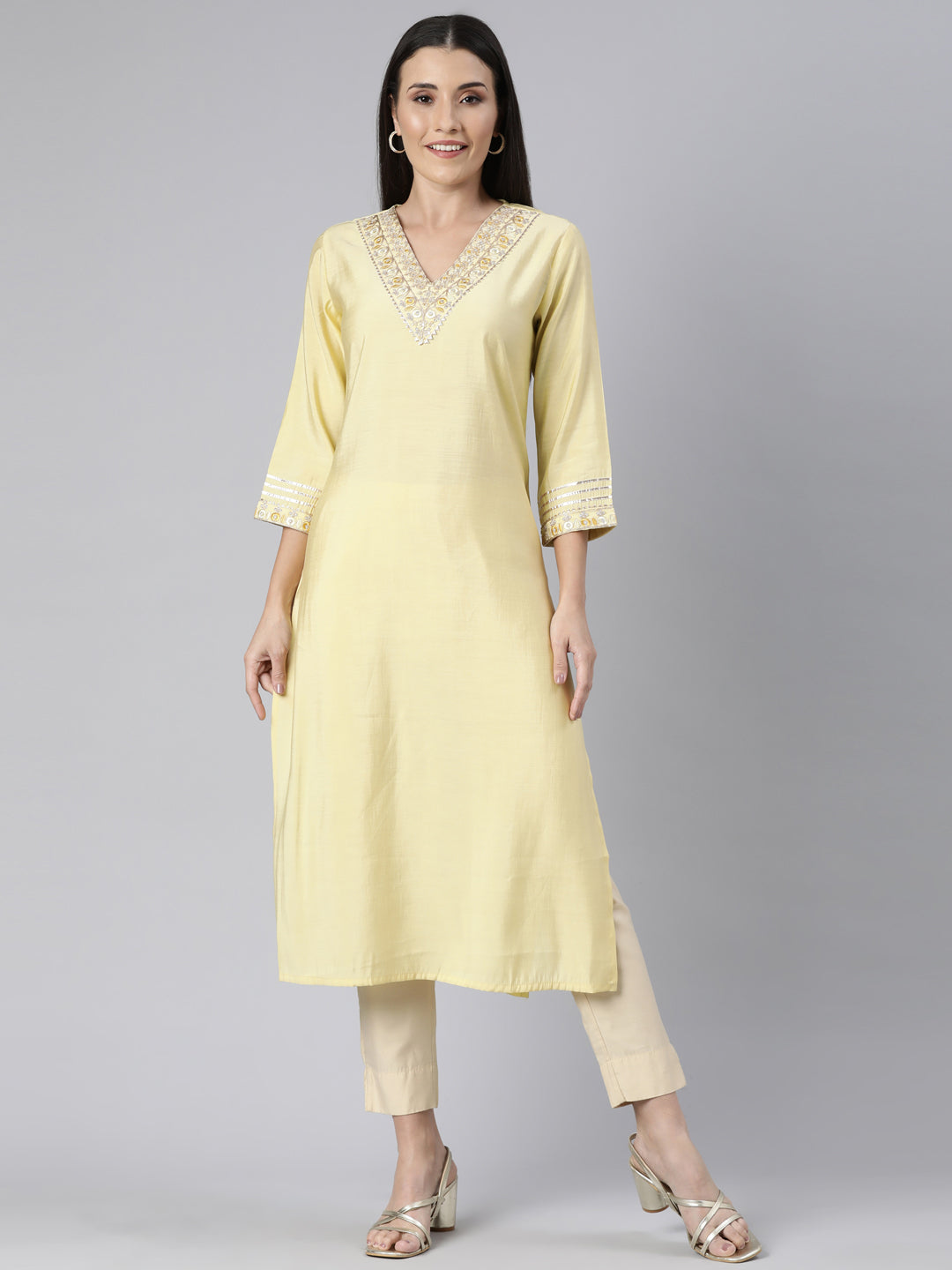 Neerus Yellow cotton solid straight kurti - front view