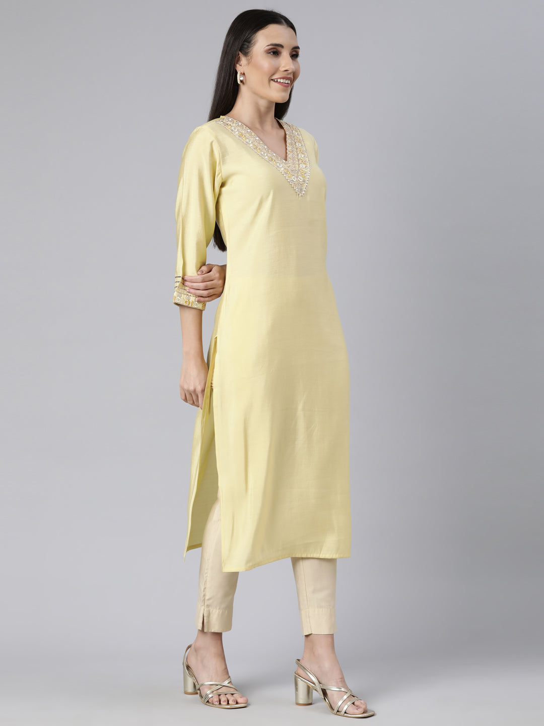 Neerus Yellow cotton solid straight kurti - back view
