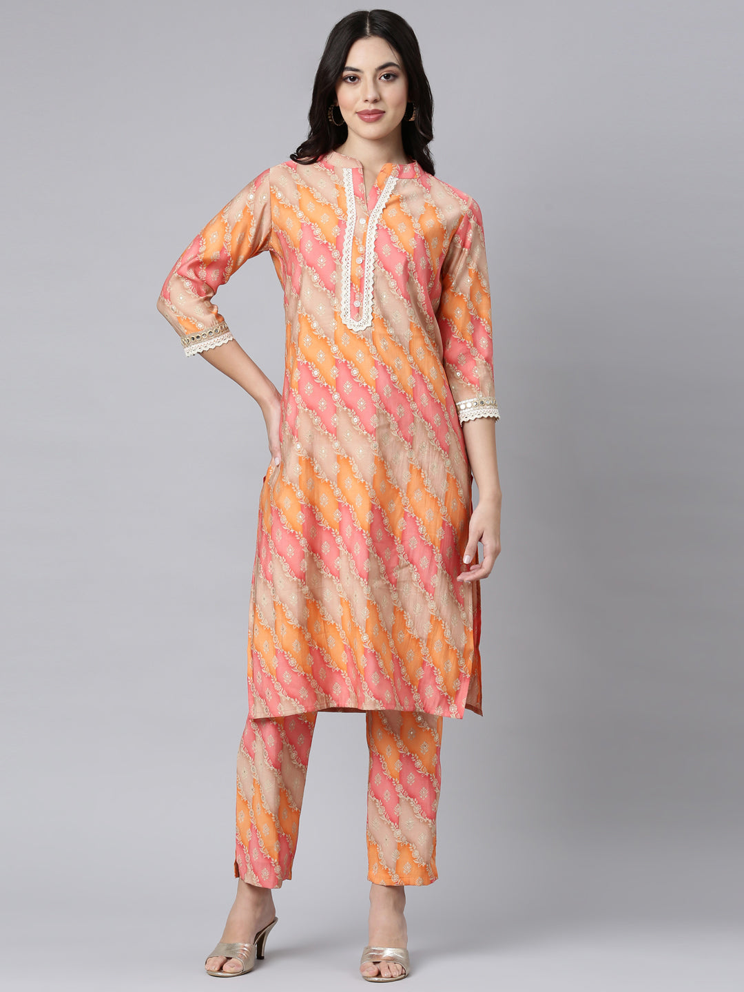 Neerus Orange muslin printed kurta set with trousers - front view
