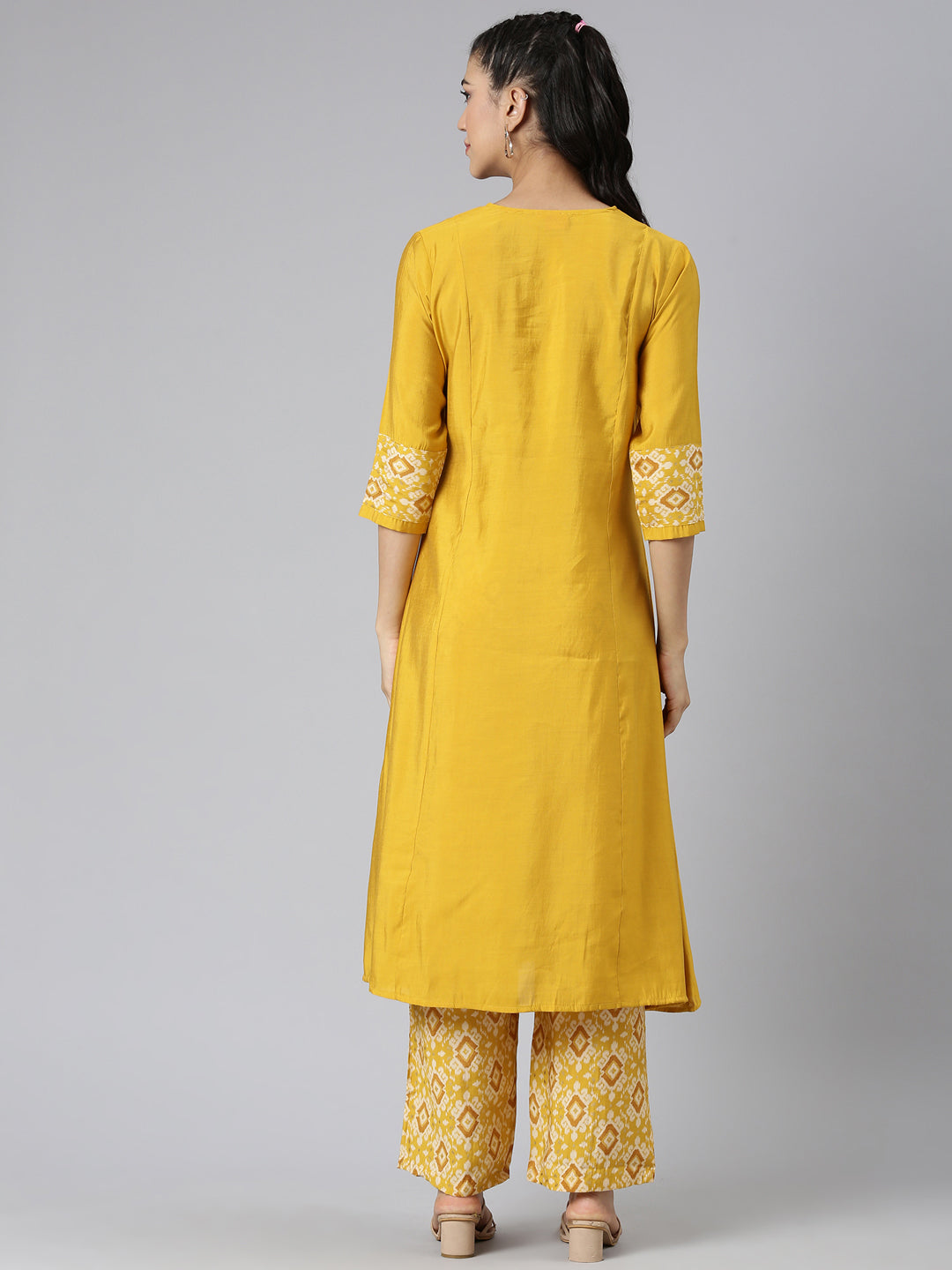 Neerus Yellow cotton solid kurta set - side view
