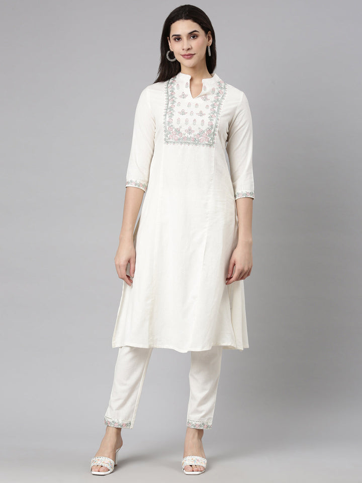Neerus Beige solid straight kurta set with trousers - front view