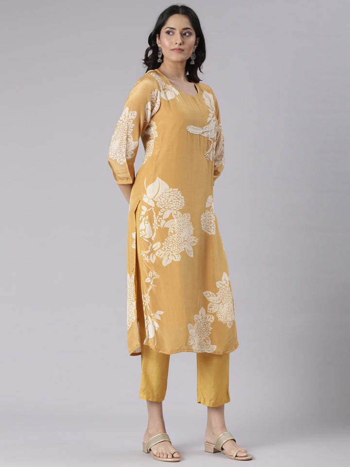 Neerus Mustard Solid Straight Kurta and Trousers With Dupatta