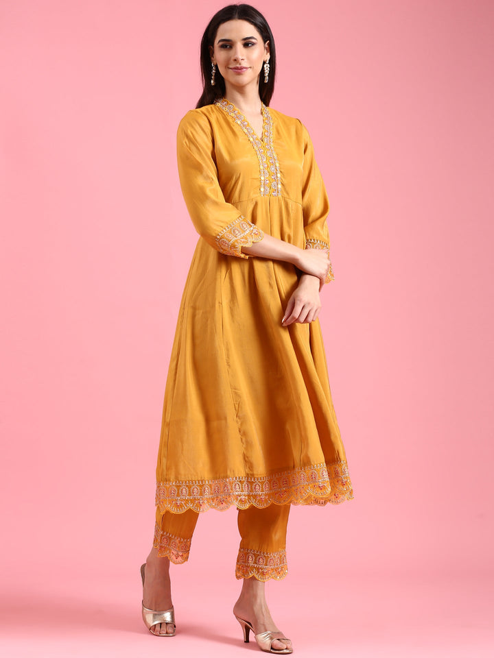Neerus Yellow silk embellished anarkali suit set - back view