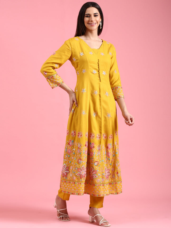 Neerus Yellow cotton embroidered Anarkali suit set - back view