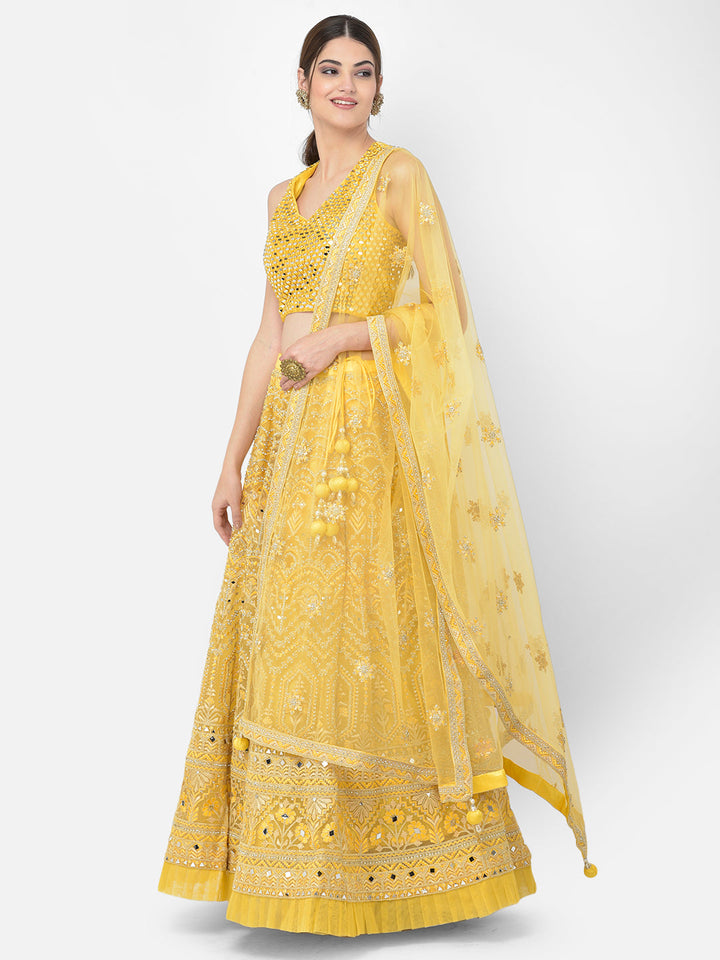 Neerus Yellow net embellished lehenga choli set - back view