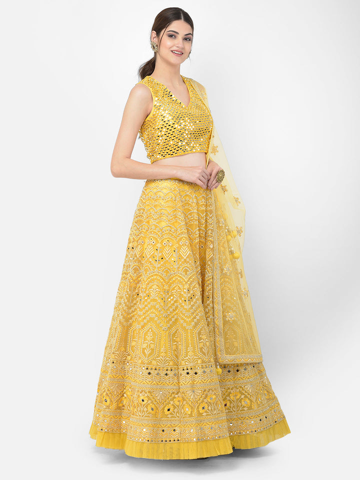 Neerus Yellow net embellished lehenga choli set - side view