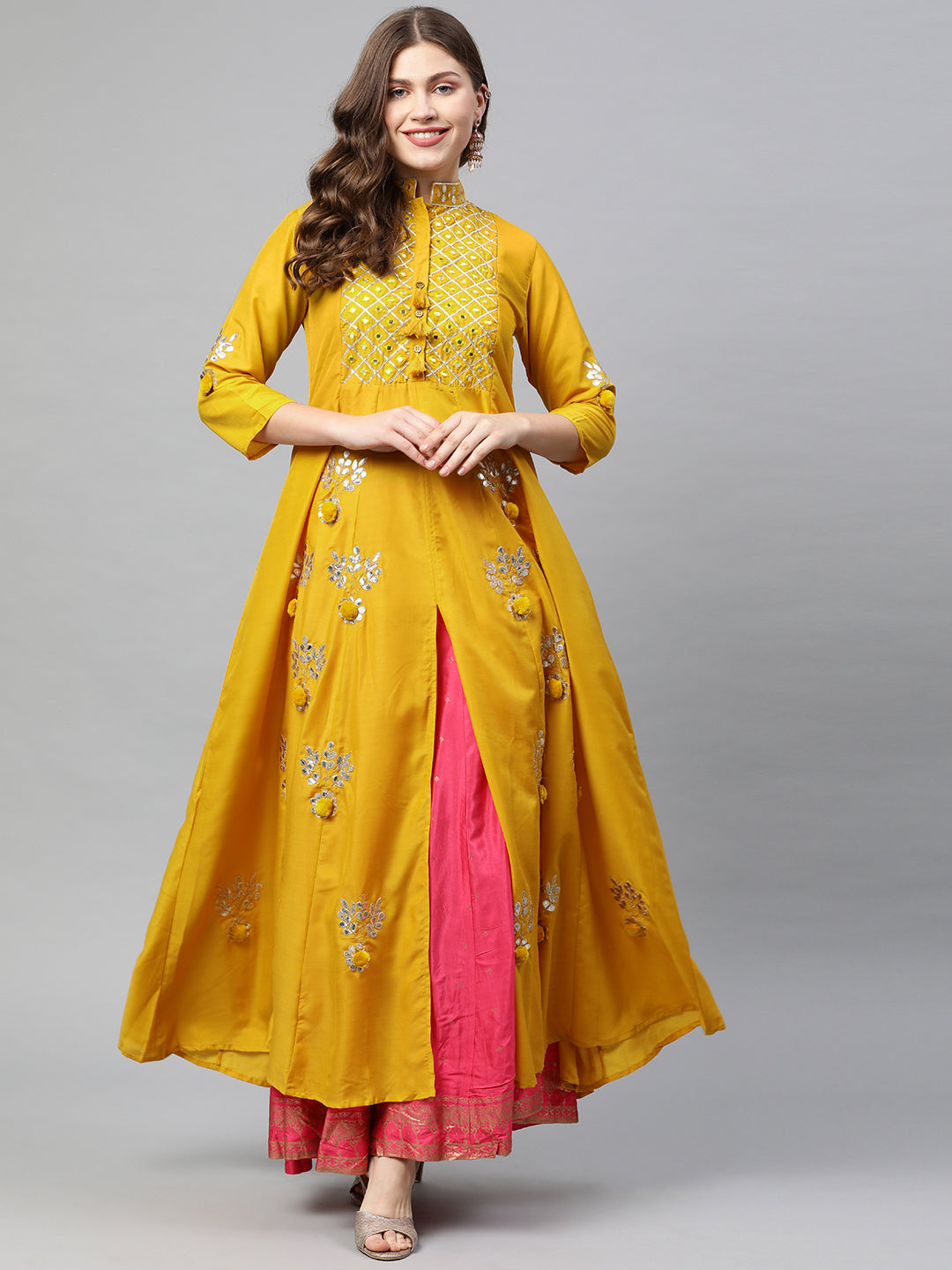 Neerus Yellow muslin embellished A-line kurta - front view