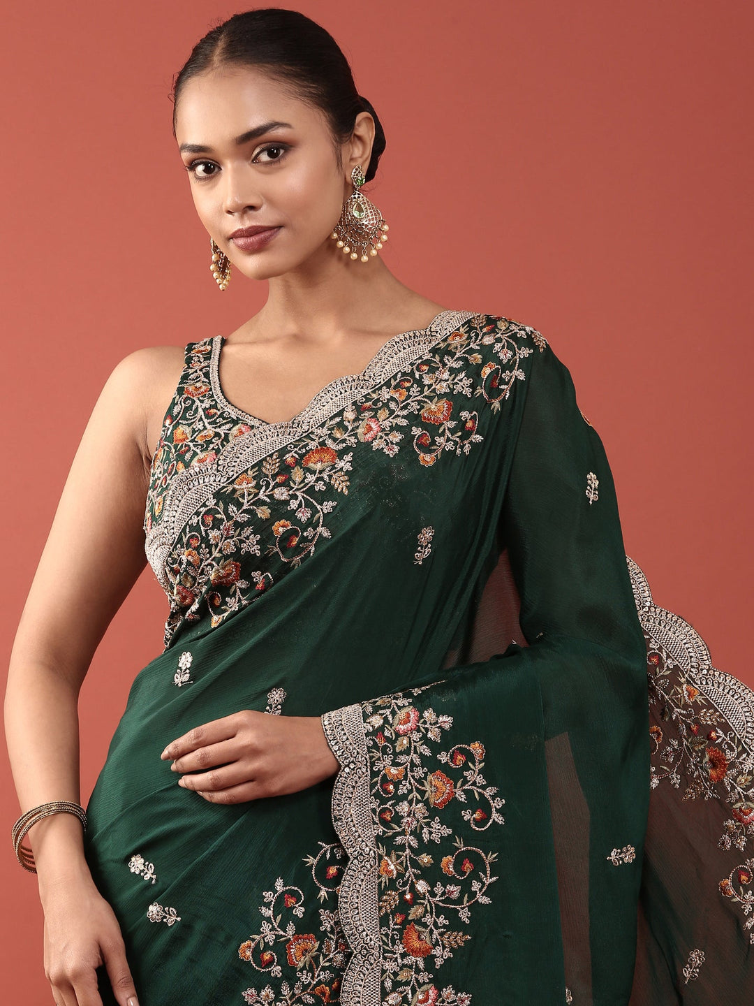 Neerus Green crepe embroidered saree with blouse - side view