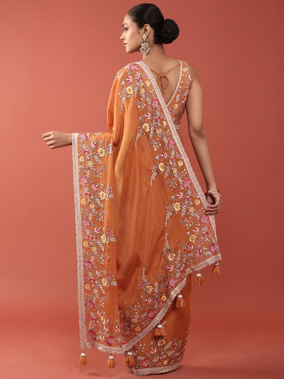 Neerus Orange crepe embroidered saree with blouse - back view