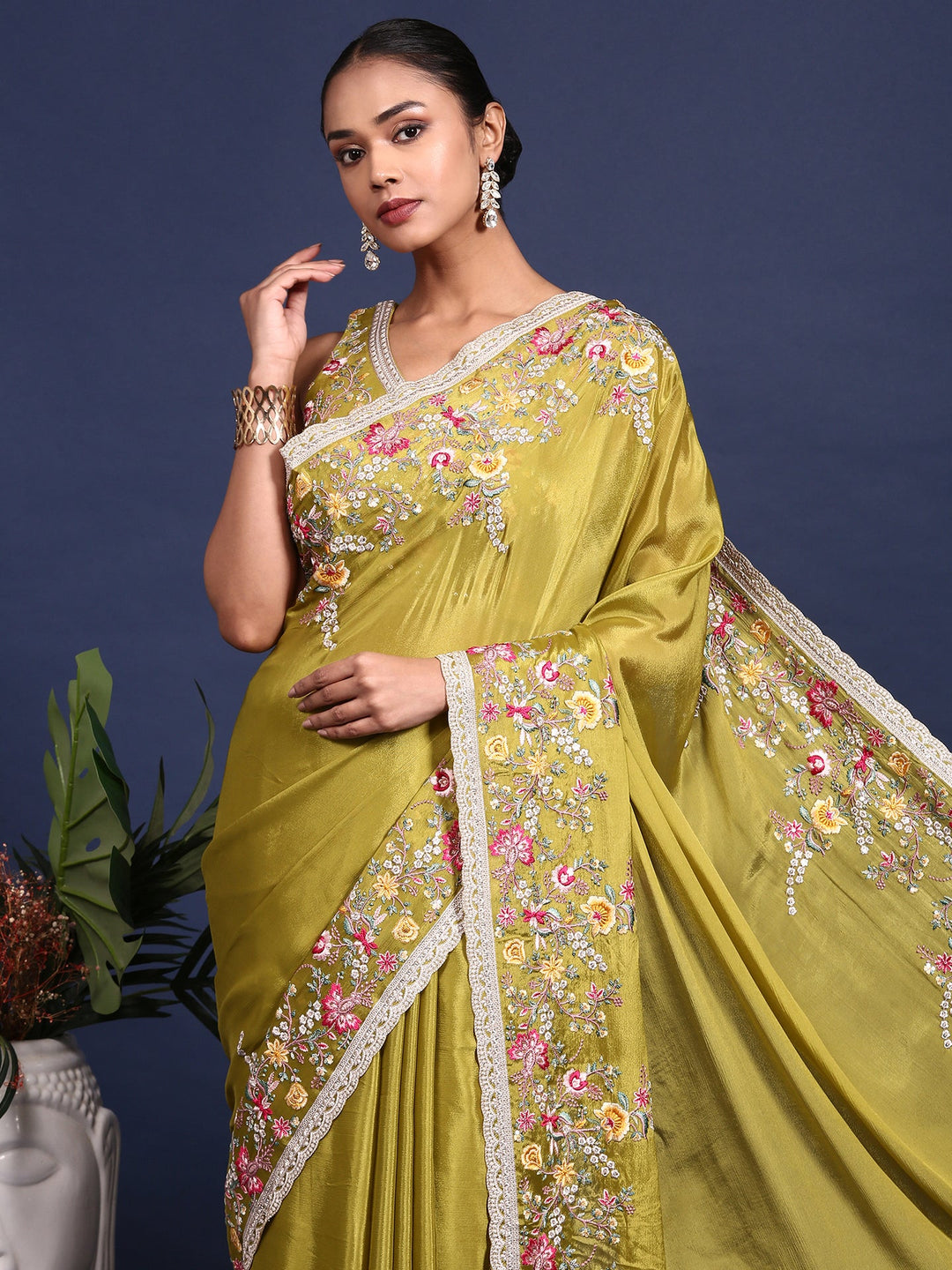 Neerus Green crepe embroidered saree with blouse - back view