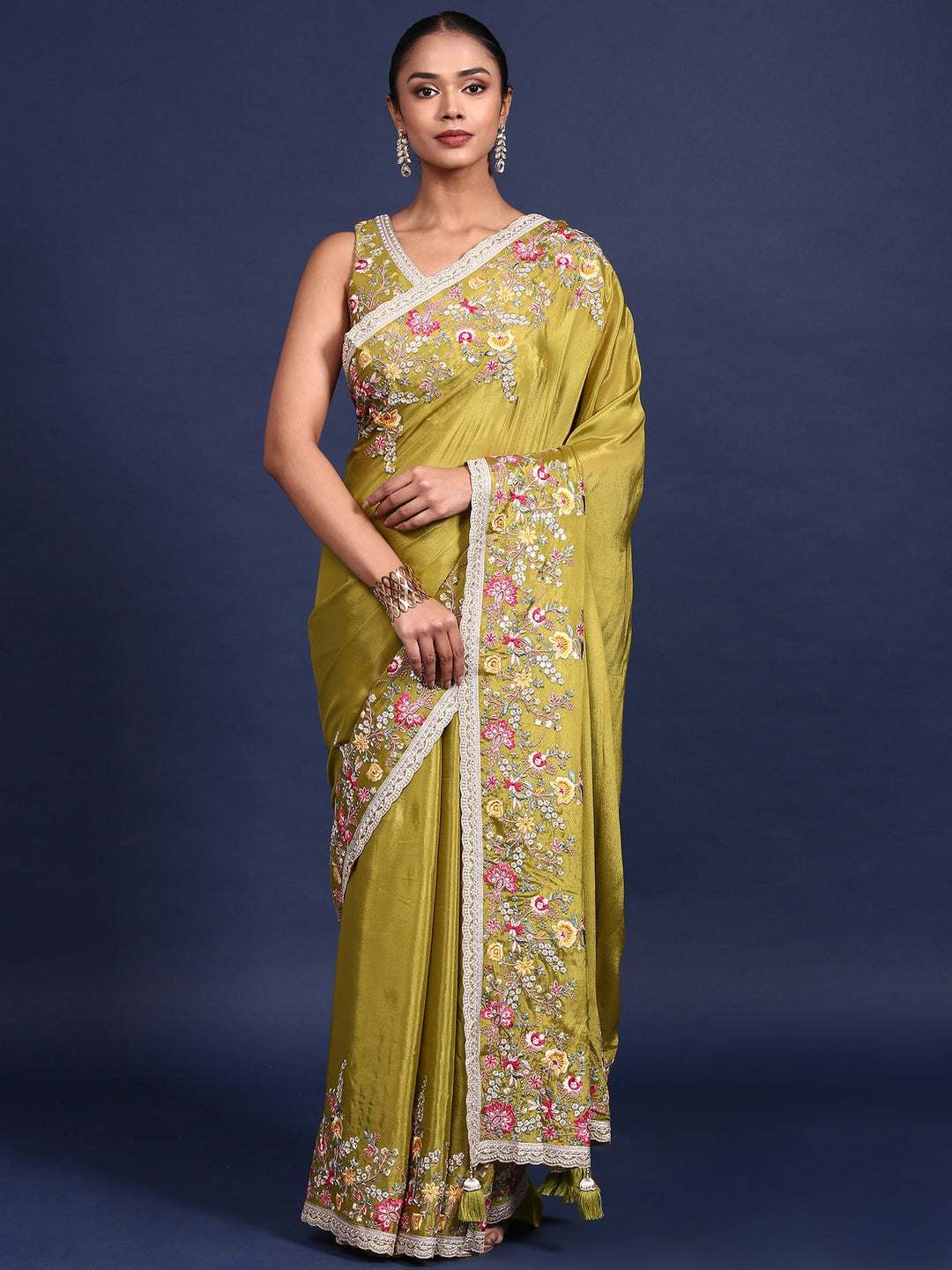 Neerus Green crepe embroidered saree with blouse - front view