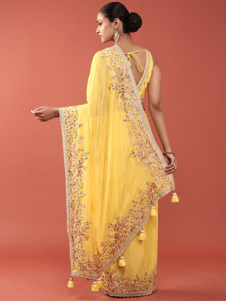 Neerus Yellow crepe embroidered saree with blouse - side view