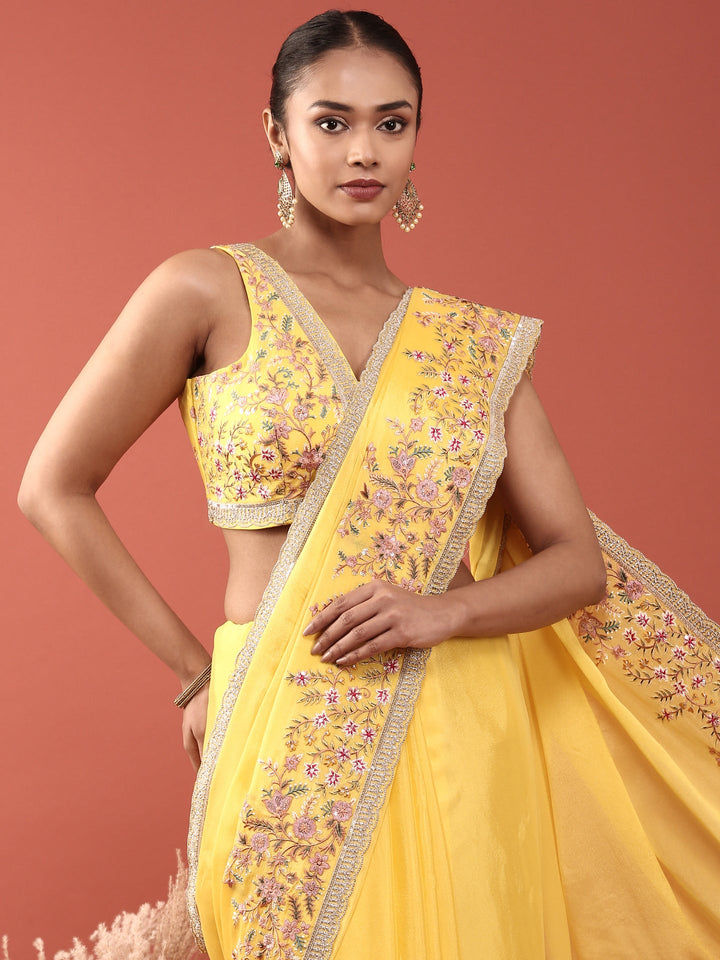 Neerus Yellow crepe embroidered saree with blouse - back view