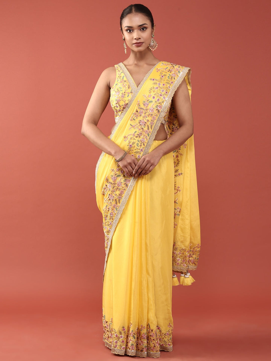 Neerus Yellow crepe embroidered saree with blouse - front view