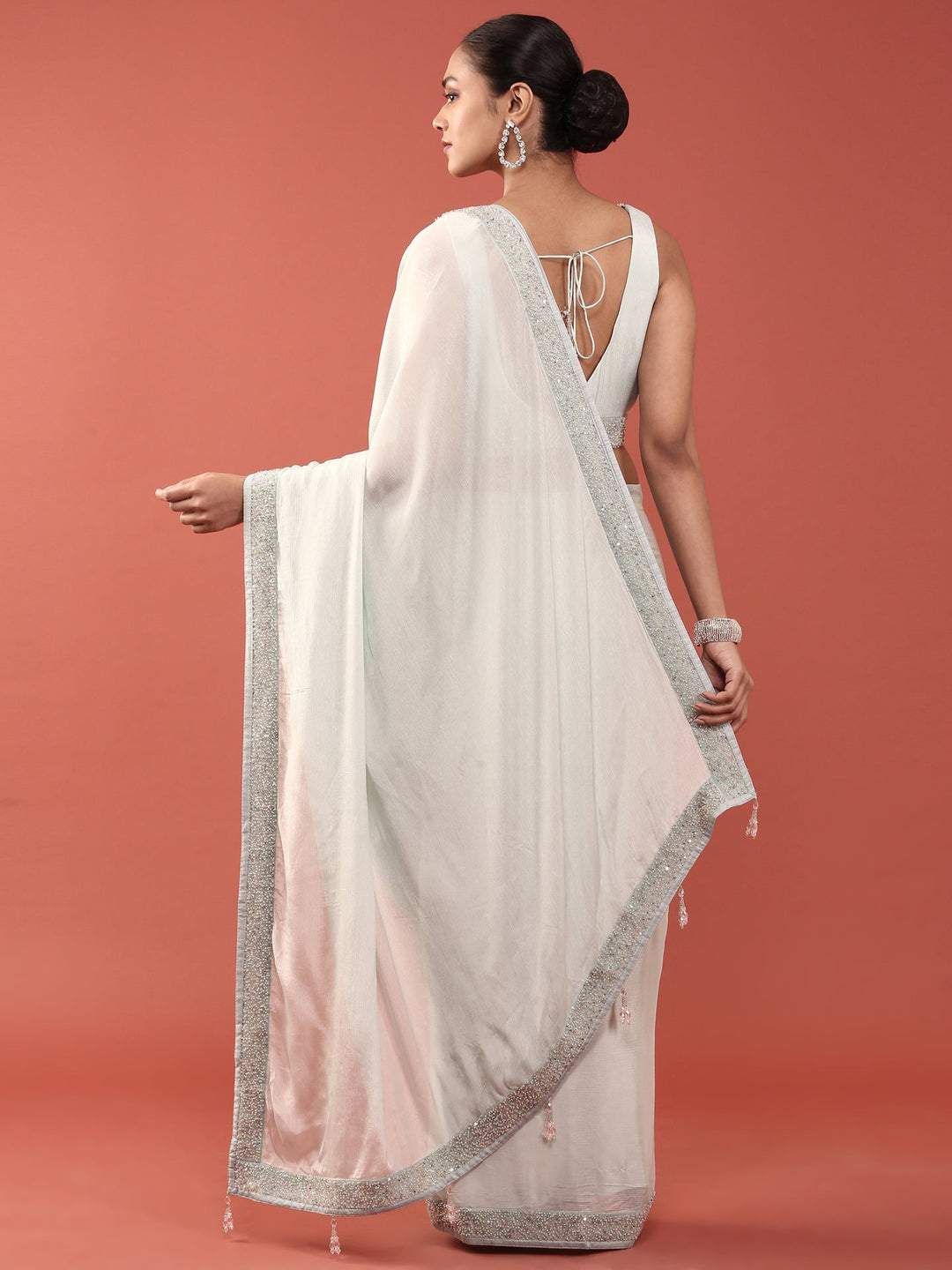 Neerus Blue crepe embellished saree with readymade blouse - side view
