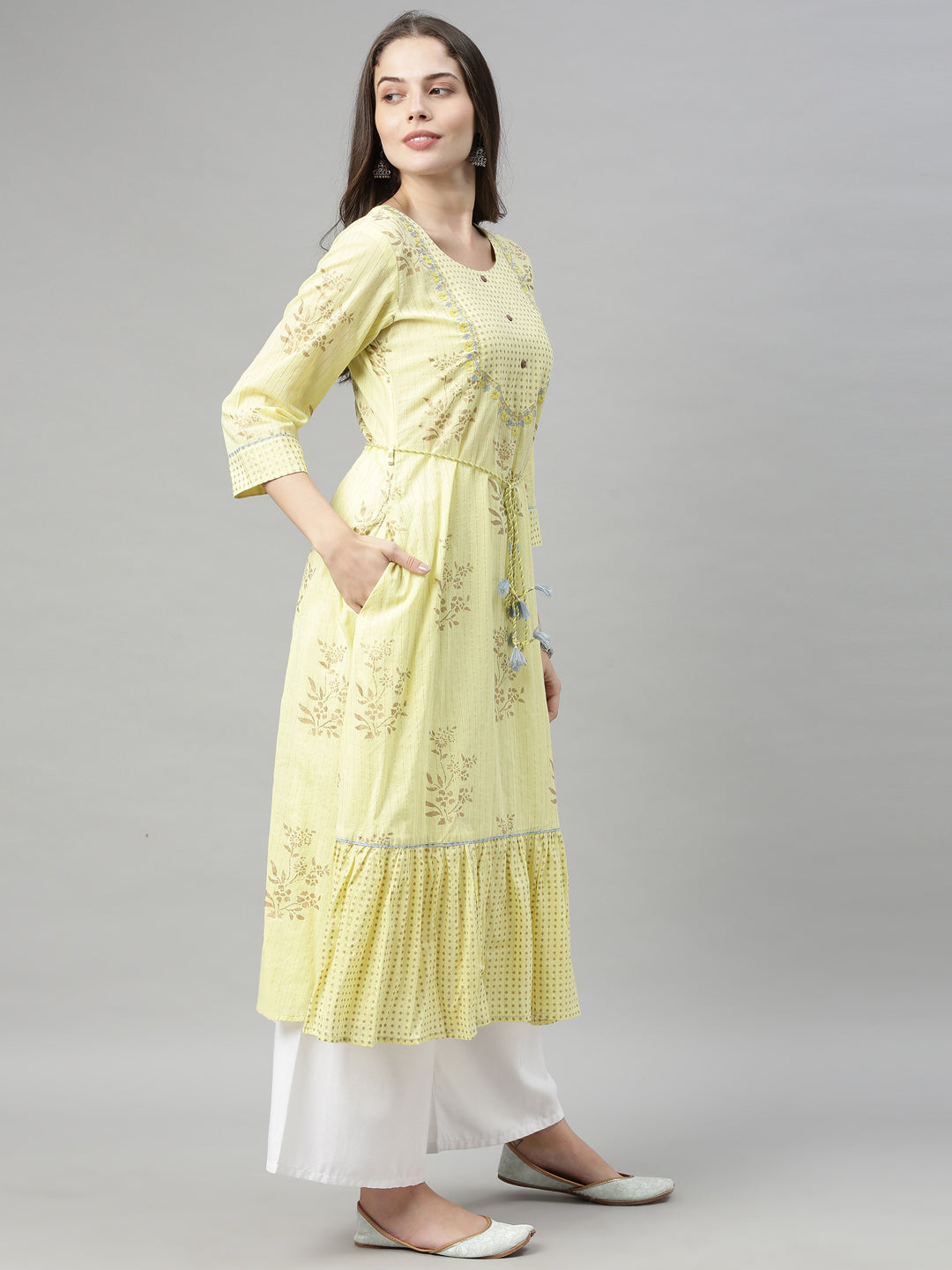 Neerus Yellow cotton chikankari A-line kurti - side view