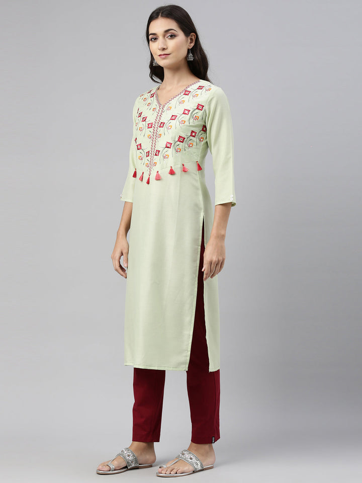 Neerus Green muslin embroidered kurti straight silhouette - back view