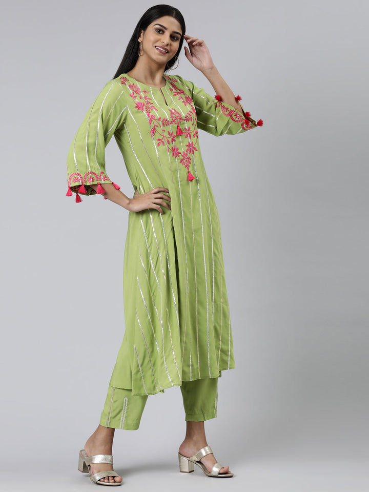 Neerus Green viscose rayon embroidered anarkali kurta set - back view